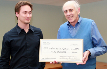 Valentino Gantz accepts the award from founding faculty member, Stu Brody