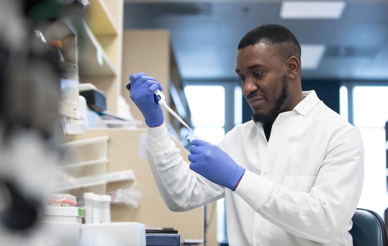 Onyeka Chukwudozie conducts research in a laboratory.