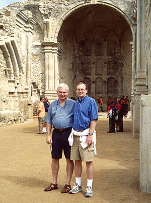 James E. Wilhelm and son standing in front of ancient ruins