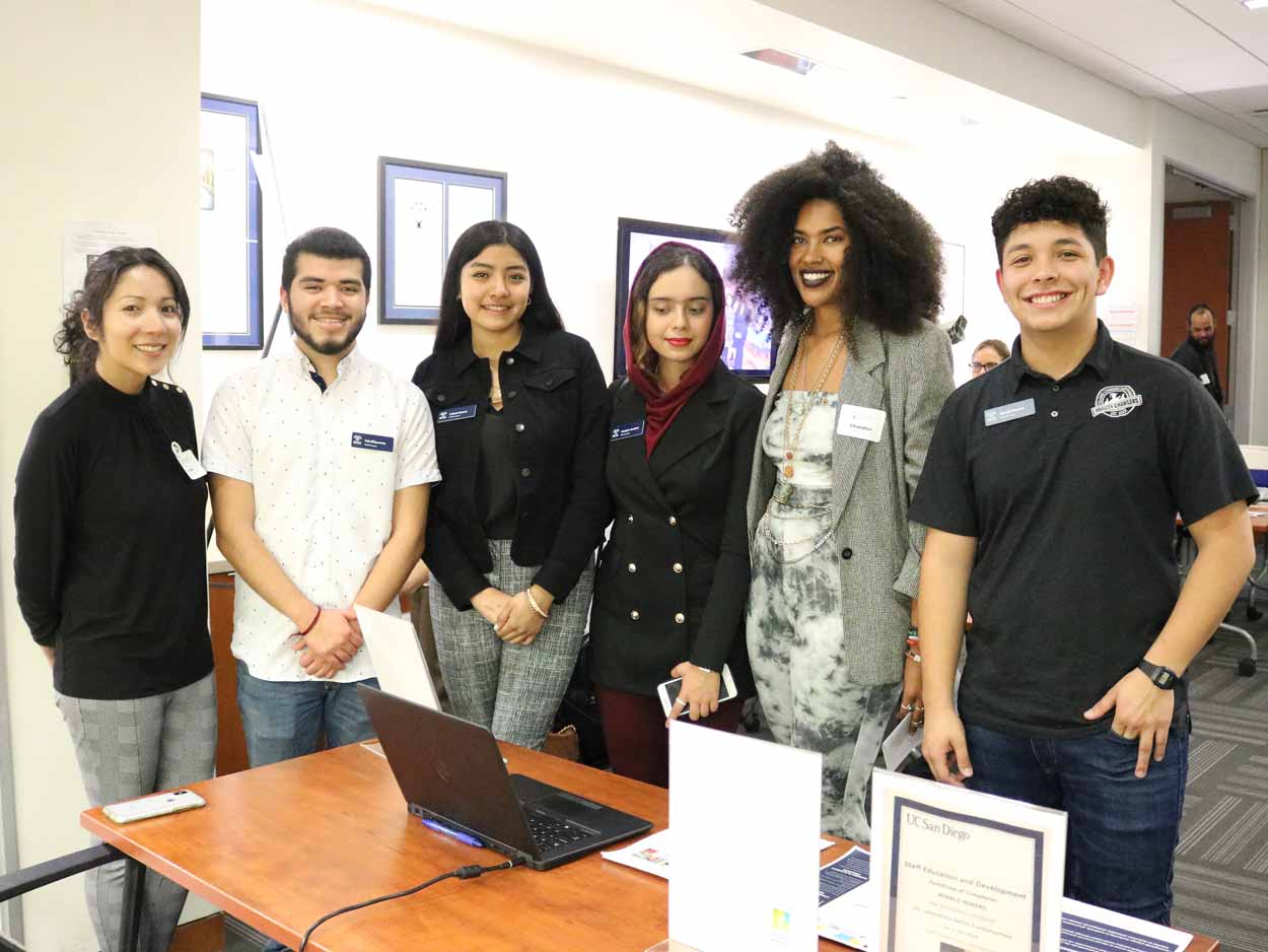 Chandler Puritty (second from right) standing next to students in the PATHS program.