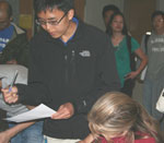 Students sign up for various BSSA activities, including the mentor-mentee program prior to the meeting.