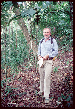 David Woodruff standing in a forest