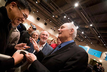 Alan Alda talking to others