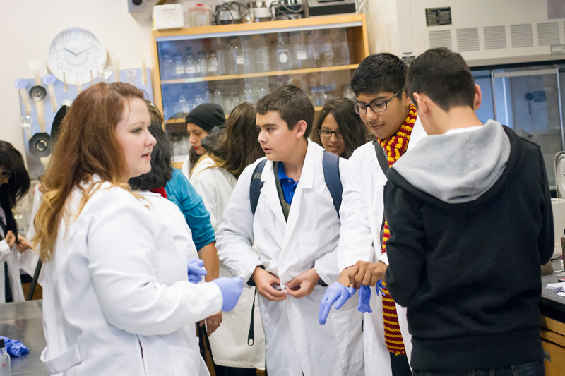 Emily Petty giving a lesson to students in the lab