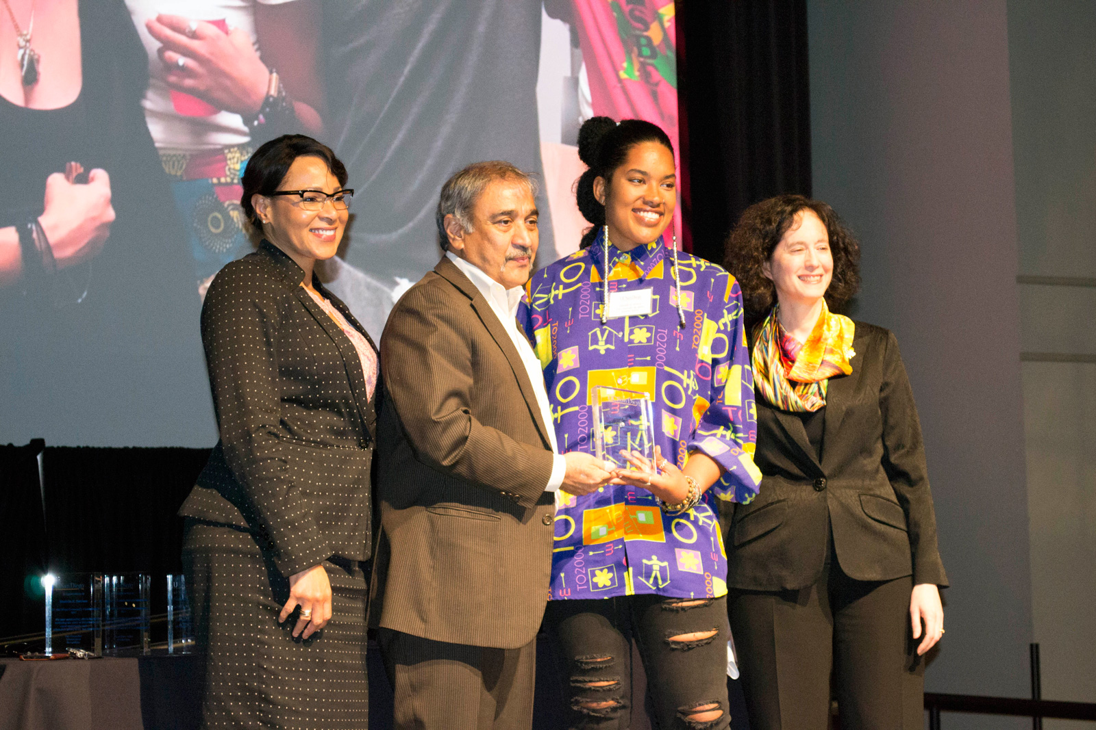 Becky Petitt, Pradeep Khosla, Puritty, and Elizabeth Simmons posing for a photo