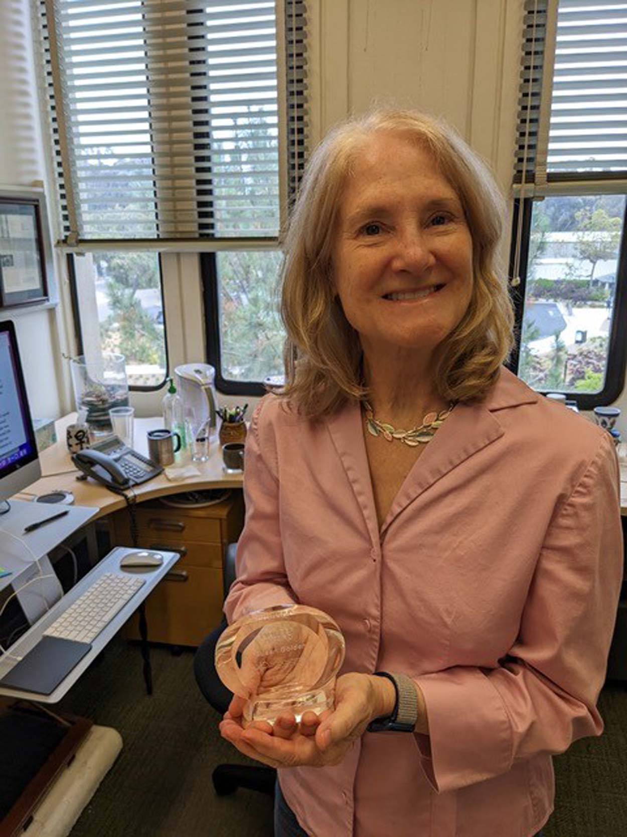 Susan Golden holding her award