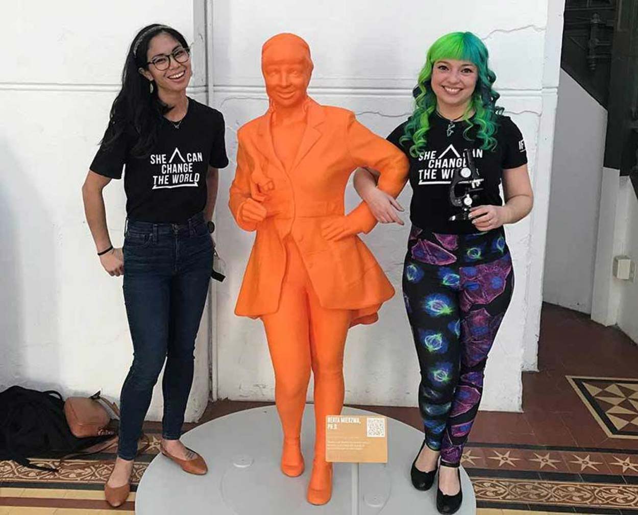 Beata Mierzwa wearing her science fashion with Claire Meaders next to Mierzwa’s statue at #IfThenSheCan - The Exhibit at the Smithsonian