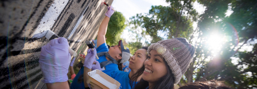 Community volunteers painting for Martin Luther King Jr. Day of Service